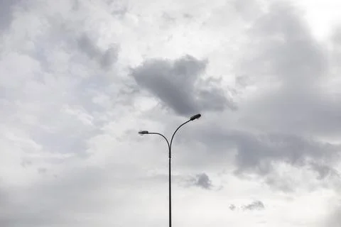 Light pole against sky. Celestial landscape in cloudy weather. Foto stock