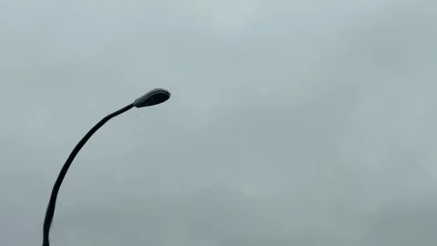 Light Pole on rainy day from car interior pov Stock Footage 302707541