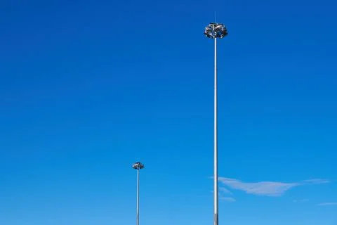 Light poles, copy space. LED light post for parking lot, blue sky background. Stock Photos