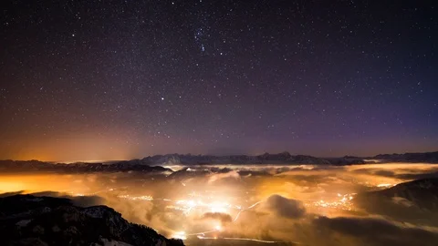 Light Pollution - Time Lapse - Stars / Milky way moving above fog Stock Footage 99356068