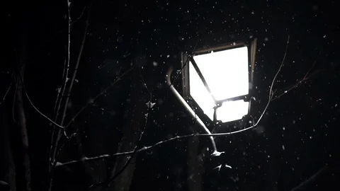 Light post at night as snow falls around it, in slow motion Stock Footage 89446022