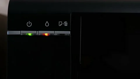 The light on the printer is on with the red printer light, out of ink, close-up Stock Footage 240020169
