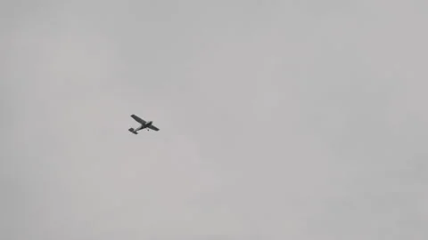 Light Propeller-Driven Aircraft Flying in the Sky Among the Clouds, Bottom view Stock Footage 153311319