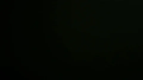 Light pulses and glows.beautiful light leak in 4K hd quality on dark background  Stock Footage 80160376