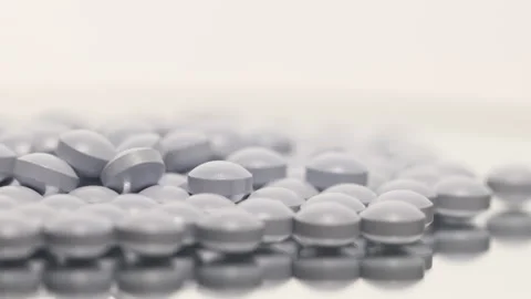 A light purple pill on a turntable. Stock Footage 249973110