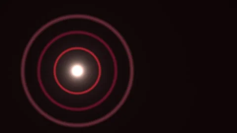 Light radiates in circles from a central point in dark Video stock 338287103