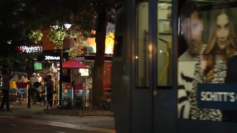 Light Rail Going Down K Street in Sacramento Followed by Bicyclists Stock Footage 170469838