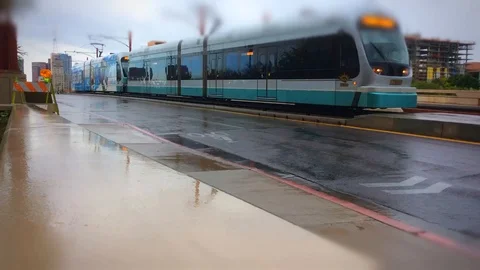 Light rail passes by on a rainy day in Phoenix, Arizona Stock Footage 88629210