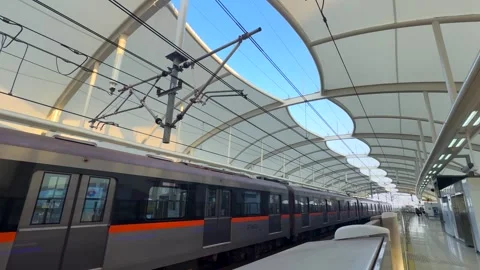 Light Rail Train Arriving at Station in Modern City Stock Footage 331906430