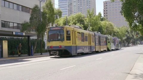 Light Rail train Driving away Downtown 8K Stock-Footage 249689529