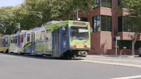 Light Rail train Driving By Downtown Stock Footage 249418141