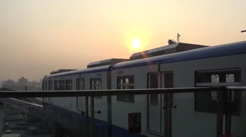 Light rail train leaving the station in the sunset Stock Footage 44894931