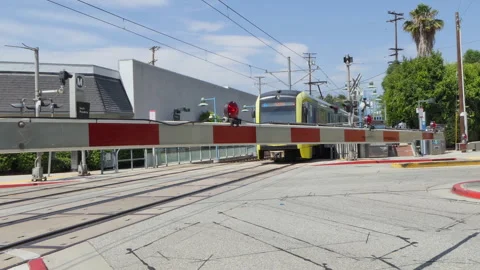 Light Rail Train Passing At Train Crossing Video stock 246714903