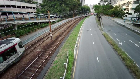 A light rail transit crossing the road in Hong Kong Stock Footage 130222166
