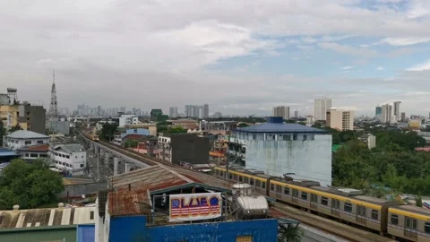 Light Rail Transit or Train Passing in Metro Manila Stock Footage 221210242