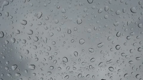 Light rain dripping onto a windshield when the sky is overcast, Mittersill, Stock Footage 342452494