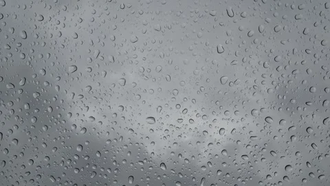 Light rain dripping onto a windshield when the sky is overcast, Mittersill, Stock Footage 342452808