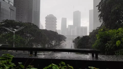 Light rain drizzles over Sudirman Street - 20250210 092616167 Stock Footage 301867357