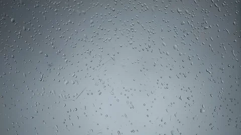 Light rain drops drizzle on a clear window glass Stock Footage 77632690