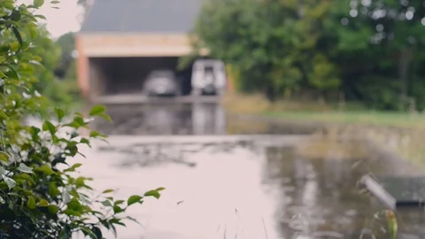 Light rain falling in front of garage Stock Footage 94097183