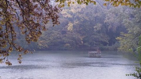 Light rain falling at Maksimir park lake, Zagreb, Croatia. Stock Footage 145966194