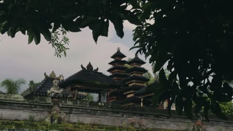 Light Rain on Mango Leaves Foreground with Balinese Temple Background Stock Footage 333333404