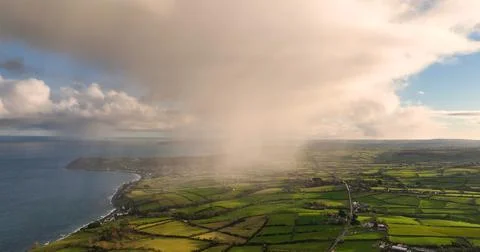Light rain mizzle clouds over Ballygally on Co Antrim Northern Ireland Stock Photos