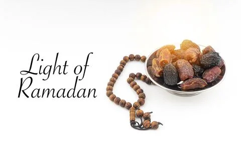 LIGHT OF RAMADAN text with Dates or kurma fruits and rosary beads or Tasbih o 写真素材