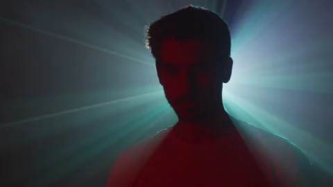 Light rays behind a young man Stock Footage 215189943