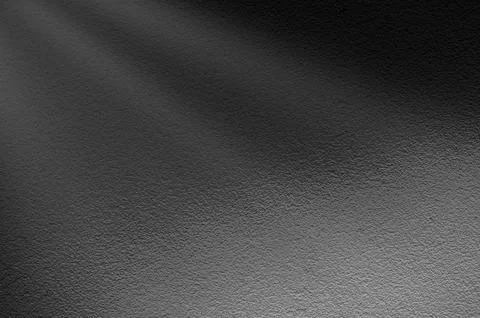 Light rays on dark grey background. Abstract grey light background. Stock Photos