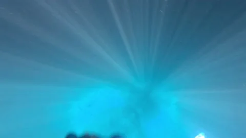 Light rays in a deep freshwater spring Stock Footage 180522712
