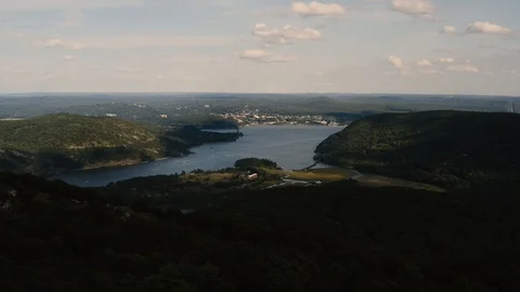 Light rays hitting the house on the river bank in the sunset 4k Stock Footage 116587305