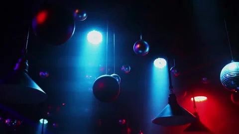 Light rays move among balls which hangs from ceiling of night club Stockbeeldmateriaal 276366871