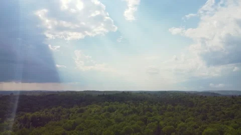 Light rays pierce through clouds in heav... | Stock Video | Pond5