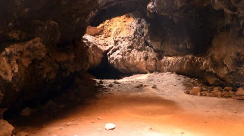 Light Rays Shine inside of Lava Tube Cave Stock Footage 26260162