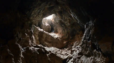 Light Rays Shine inside of Lava Tube Cave - 4K Stock Footage