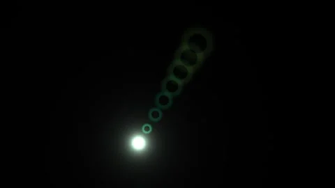 Light rays shine through circles in dark space Stock Footage 338987931