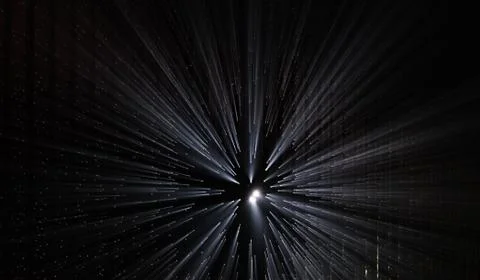 Light rays through small holes in a dark space Stock Photos