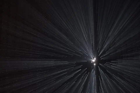 Light rays through small holes in a dark space Foto stock
