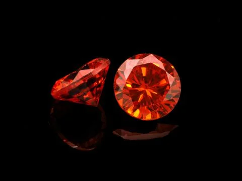 Light Red Gemstone on a Black Background Stock Photos