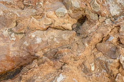 Light red-orange stone texture. Red orange grunge background. Mountain textur Stock Photos