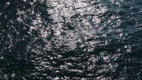 Light reflected and refracted off the sea.  Abstract wave surface and texture Stock Footage 259837040