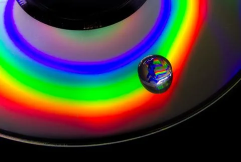 The light reflected from a cd is a collection of psychedelic colors Stock Photos