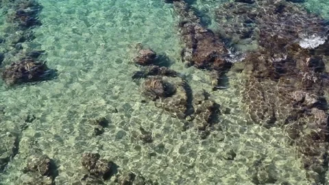 Light reflected, refracted off the crystal-clear aquamarine sea. Stock Footage 221624771