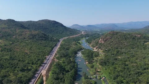 Light reflecting on Crocodile River winding through rugged African valley Stock Footage 340259681
