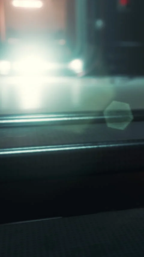 Light reflecting on a surface in a urban setting at night Stock Footage 337934924