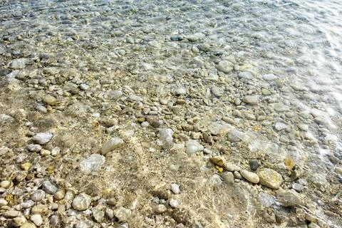 Light reflection on blue-white sea surface. Abstract texture, background. Stock Photos
