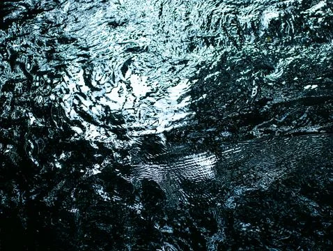 Light Reflection on Dark Ocean Water Surface at Night - Mysterious Shimmeri.. Stock Photos