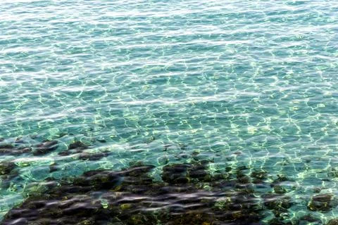 Light reflection on sea surface. Abstract texture background Stock Photos