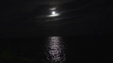 Light reflections on calm water on a full moon Stock Footage